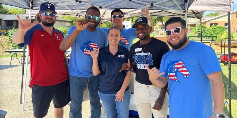 UTA student veterans and employees pose for a photo at the 2023 military resource fair