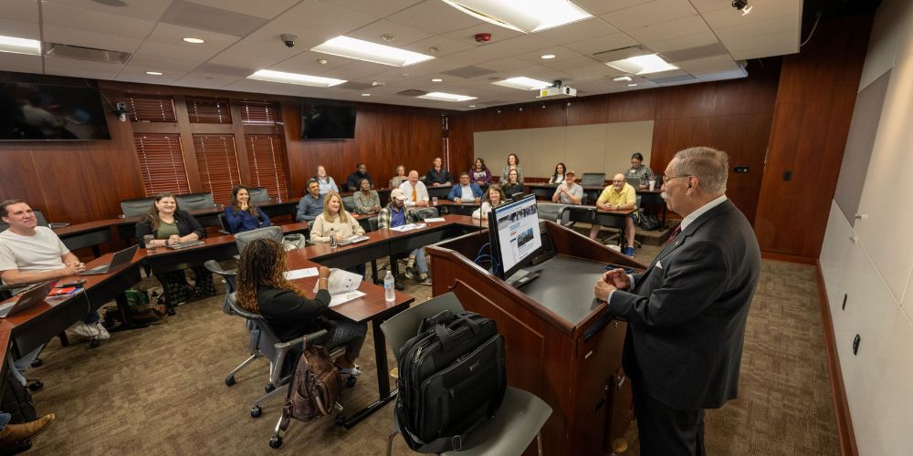 The MPA cohort students sit in a classroom" _languageinserted="true
