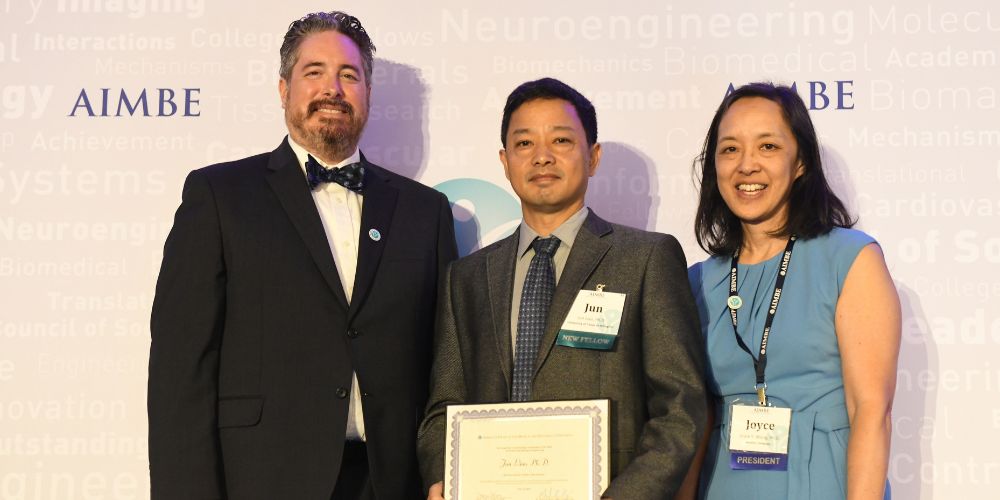 Jun Liao pictured with his award