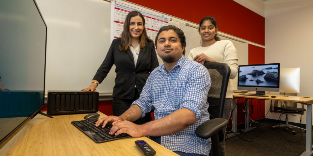 UTA researchers work on their computer 