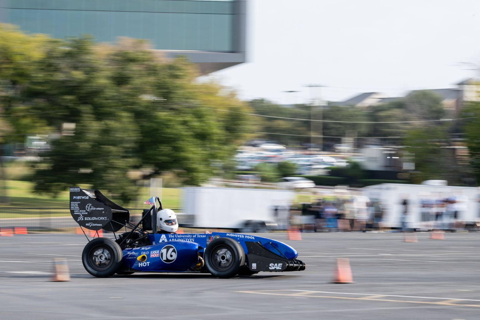 Image of a UTA Racing member racing a UTA formula car