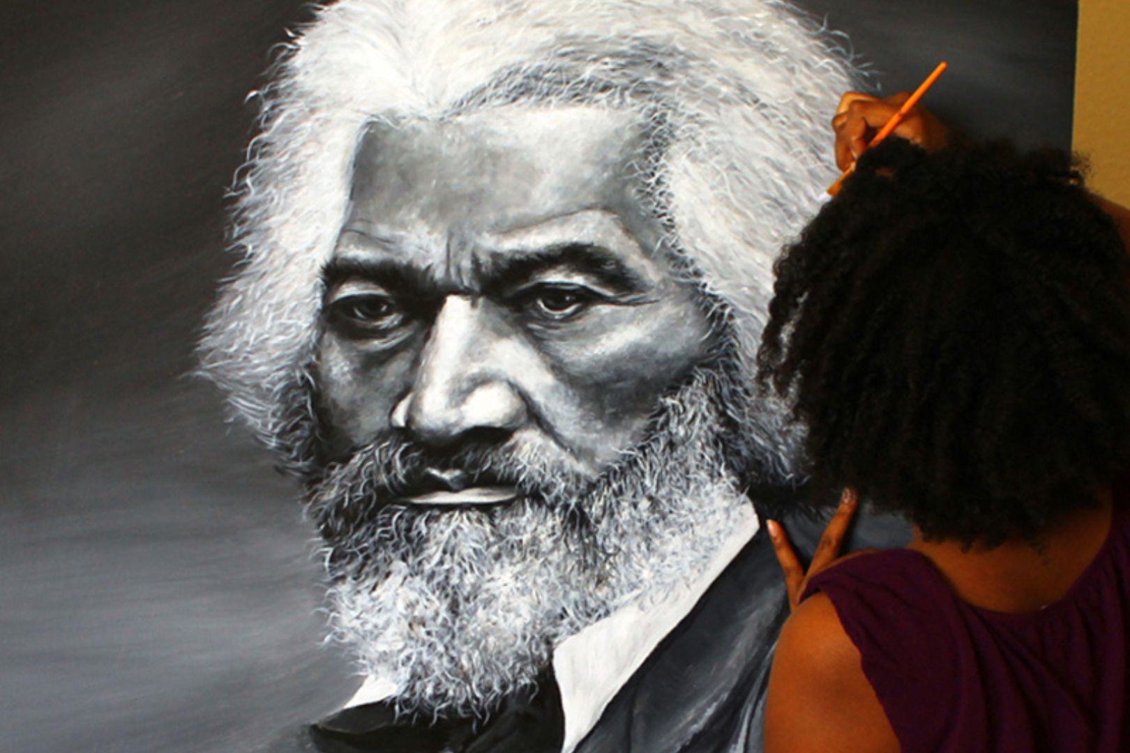 Image shows Letora Anderson working on her Frederick Douglass painting" _languageinserted="true