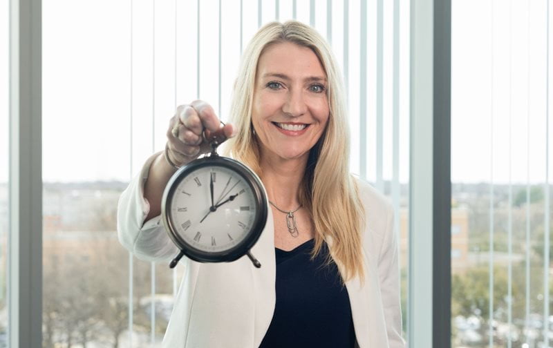 Christine Spadola holding an alarm clock