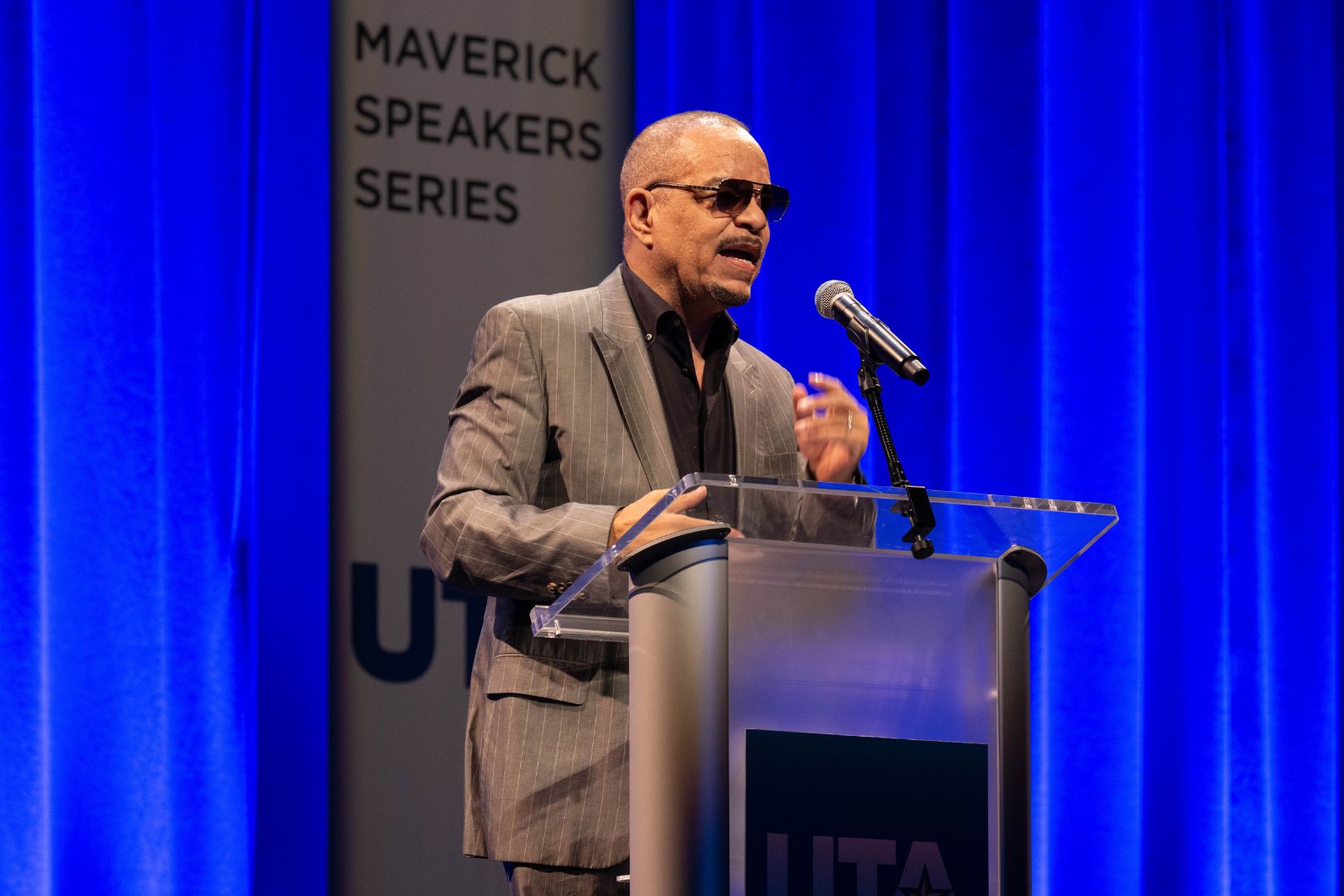 Image shows Ice-T speaking to attendees at his Maverick Speakers Series lecture