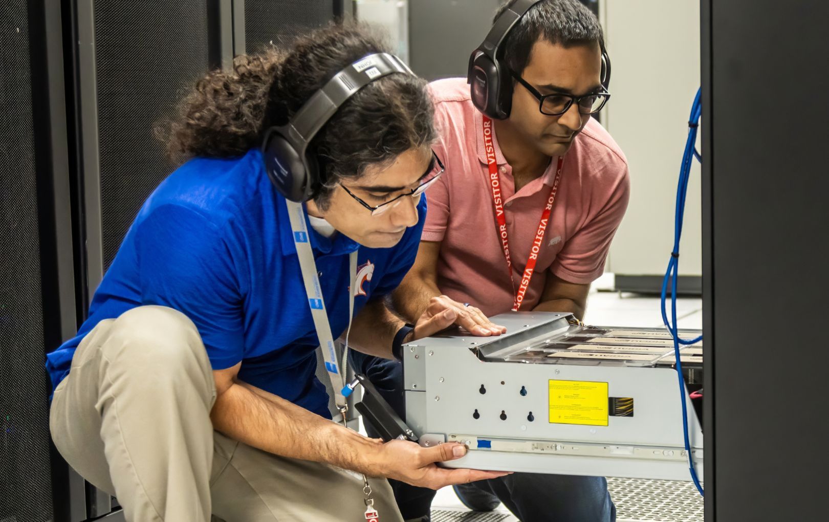Two students working on a supercomputer