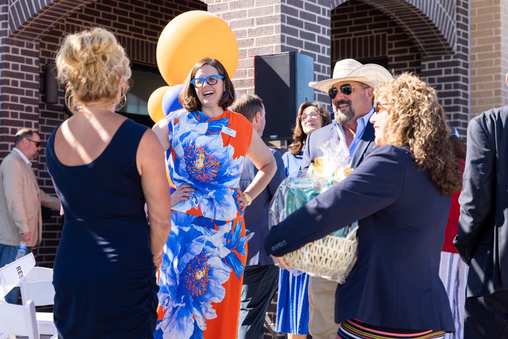 UTA President Jennifer Cowley mingles with attendees at the UTA West storefront ribbon cutting