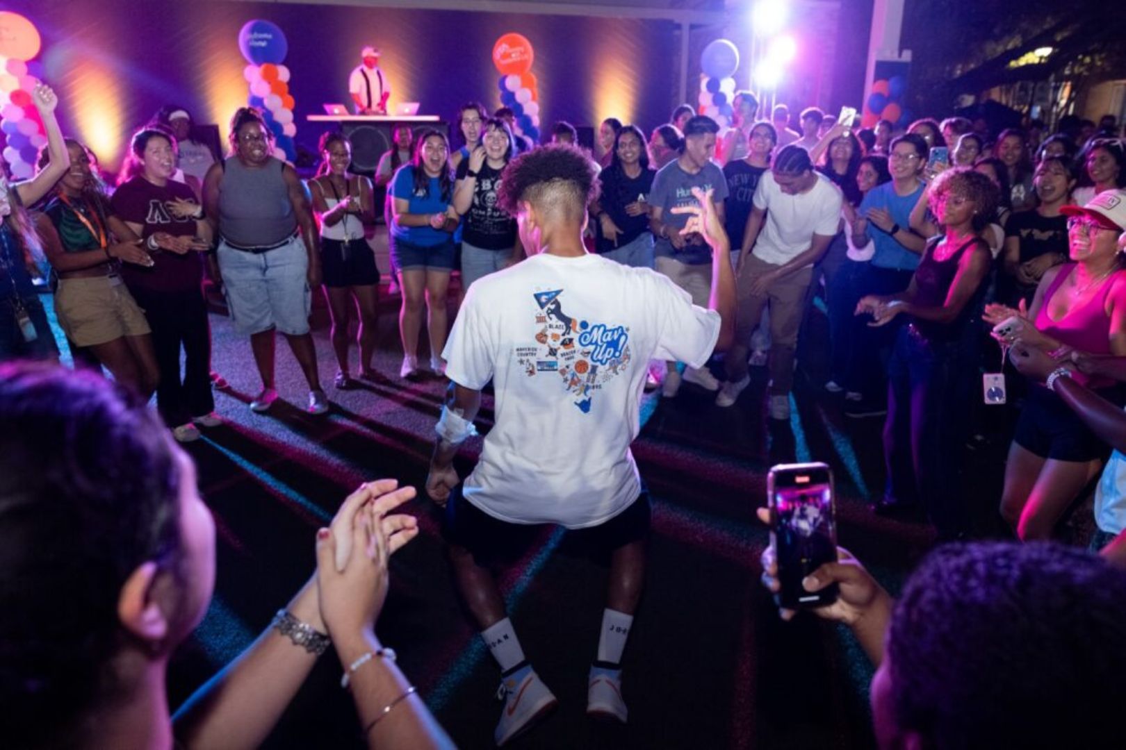 Image shows student dancing at Waffleopolis