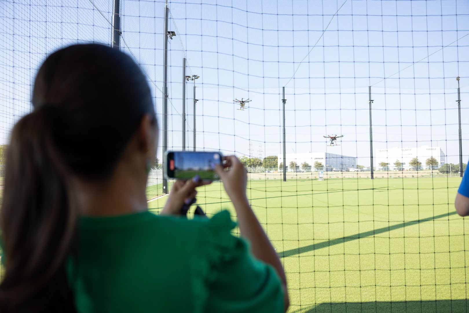 Image shows someone taking a video at the MAVRC facility " style=" height:1080px; width:1620px" _languageinserted="true" src="https://cdn.prod.web.uta.edu/-/media/project/website/news/releases/2025/09/mavrc-main.jpg