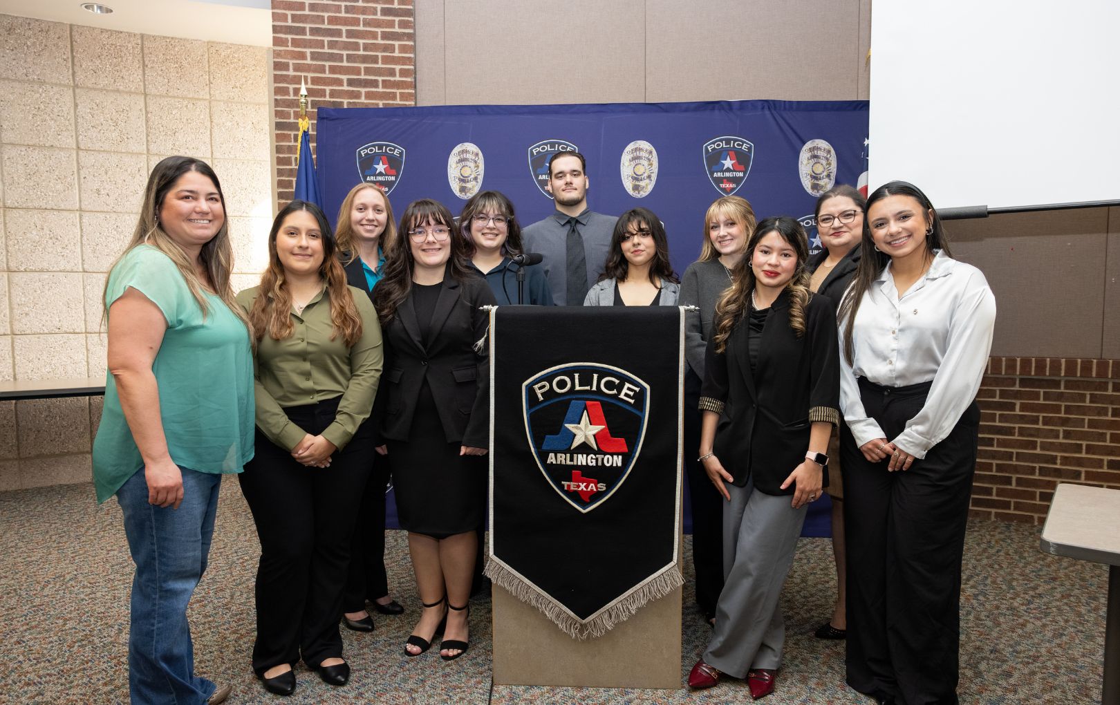 Students posed with Jessica Roberts, the daughter of Cynthia Gonzalez