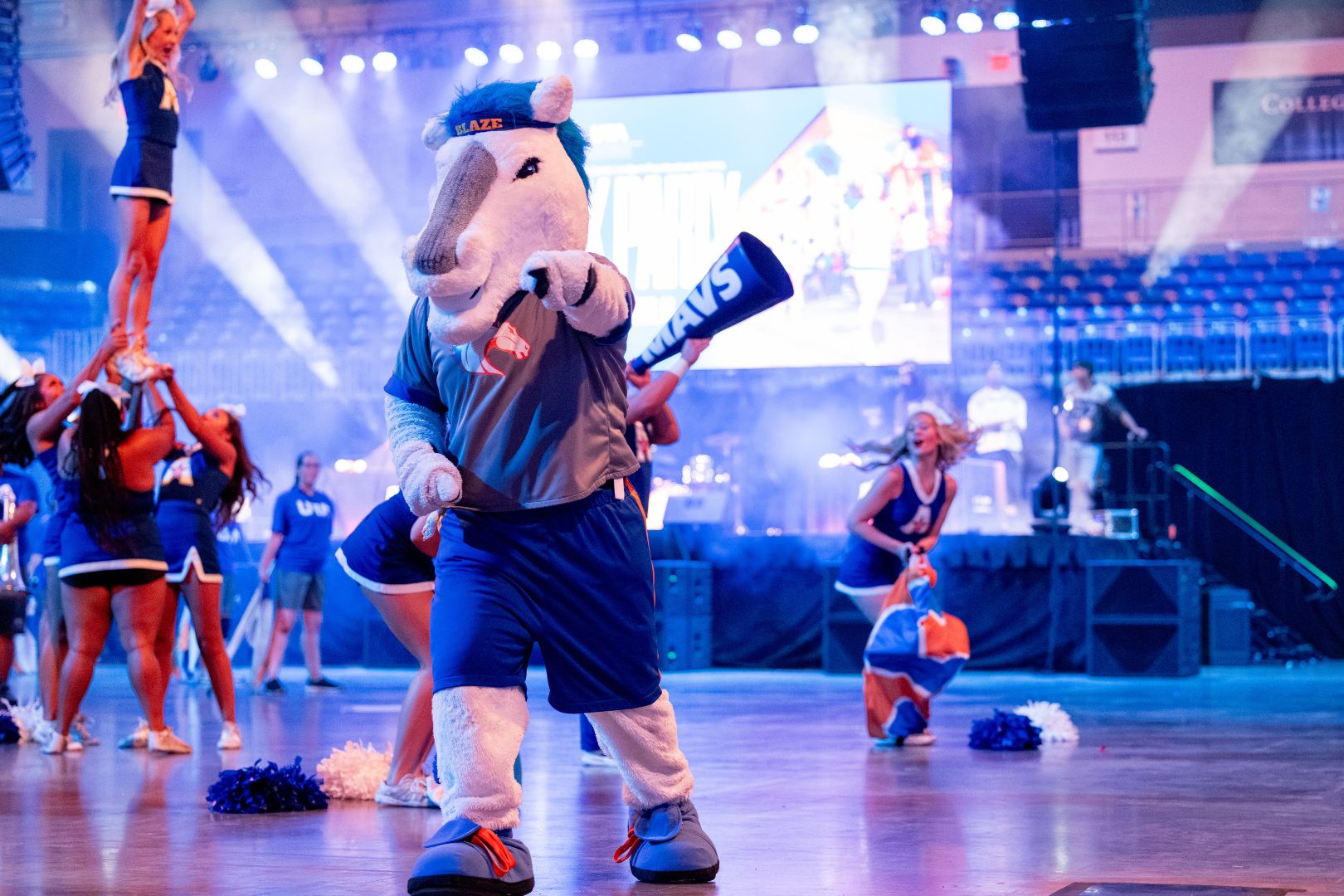 Image shows Blaze dancing at UTA's Block Party