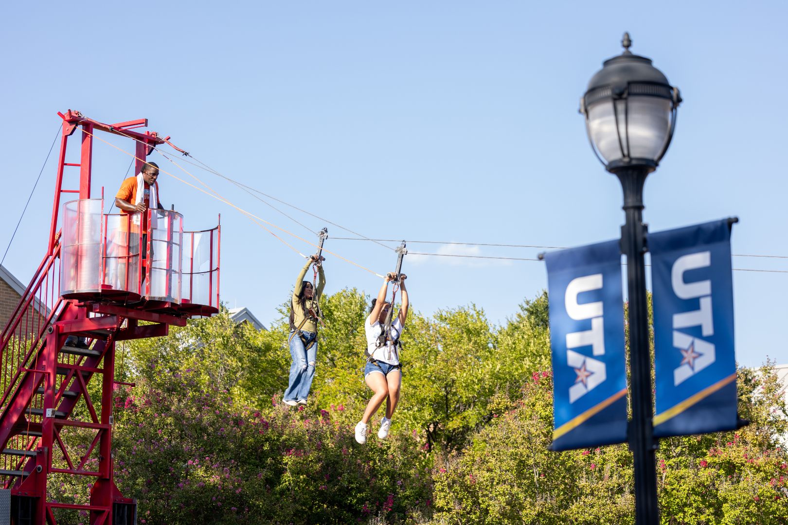 Image shows students use the zip line at the MavsMeet event " style=" height:1080px; width:1620px" _languageinserted="true