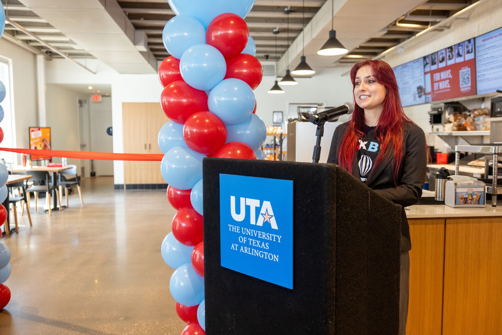 Student CEO Kylie Vaughan addresses audience at Saxbys grand opening event " style=" height:1080px; width:1620px" _languageinserted="true" src="https://cdn.prod.web.uta.edu/-/media/project/website/news/releases/2026/08/sax-inside-2.jpg