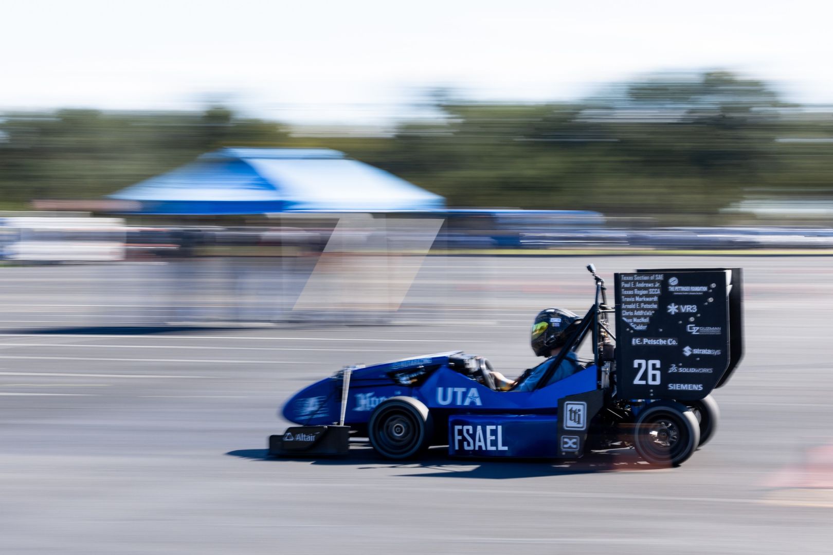 Image shows a UTA Racing car in action at Texas Autocross Weekend