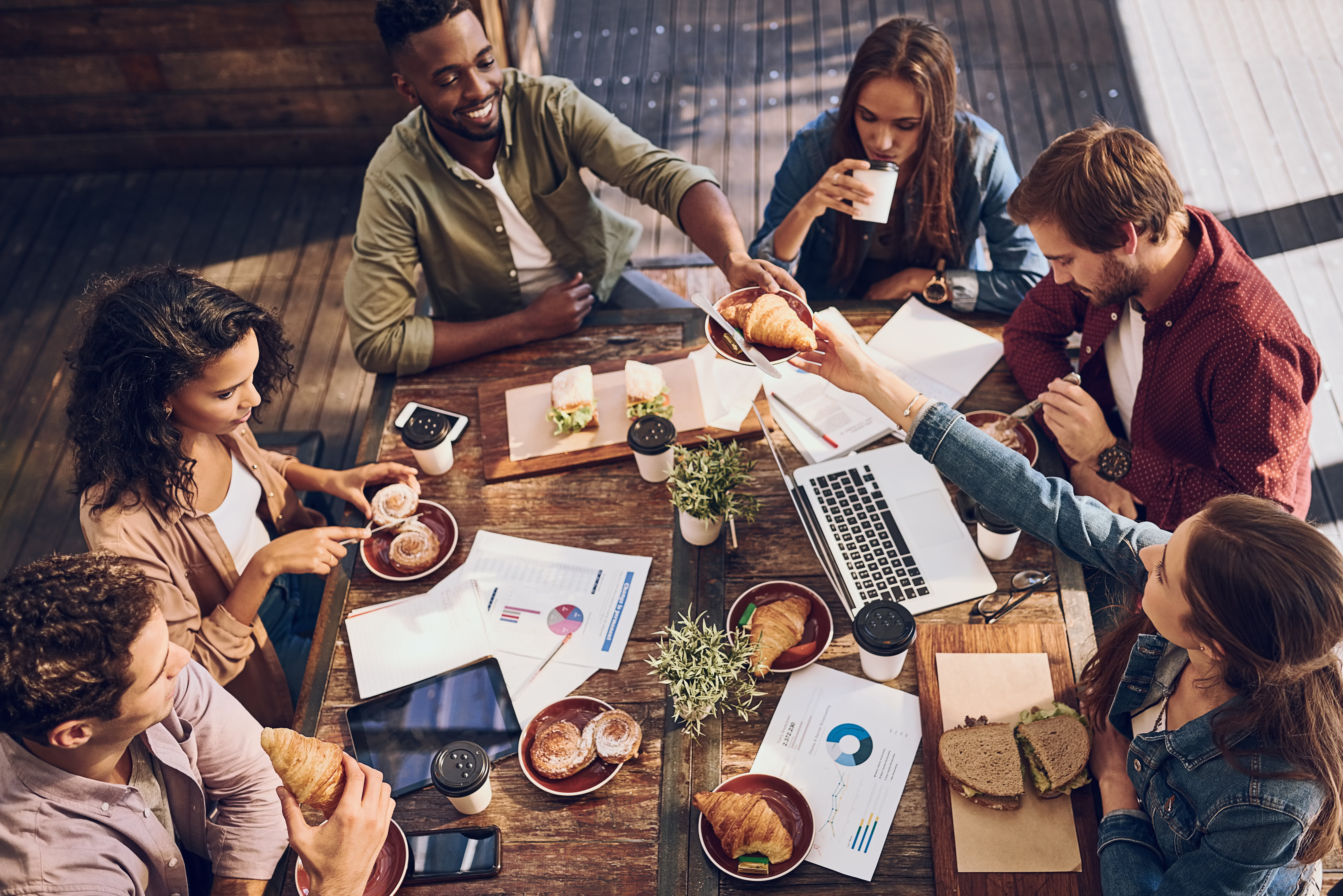 Group of people having a meeting over lunch