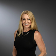 Rachel Biggs smiling brightly at the camera