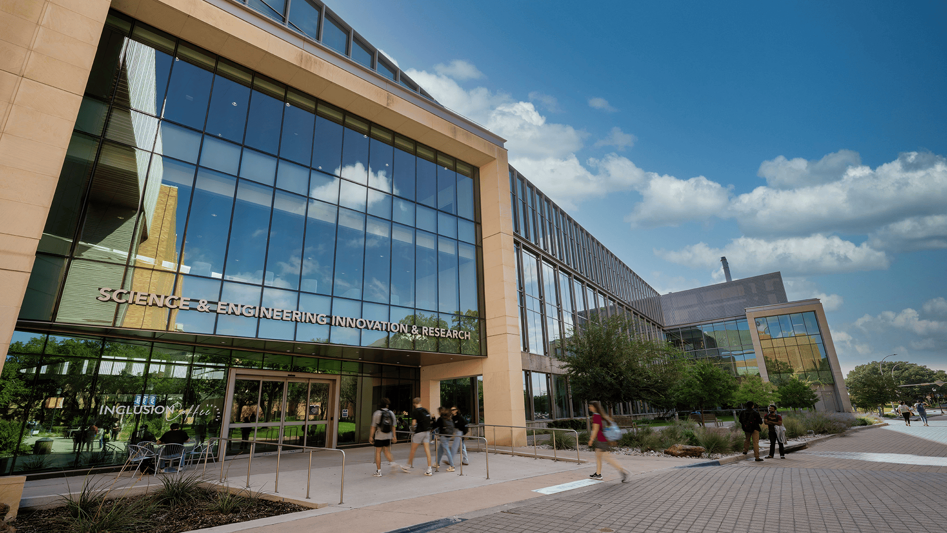 UTA students walking into the SEIR building