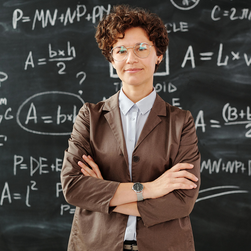 Professor standing in front of blackboard