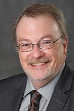 Headshot of James K McCusker