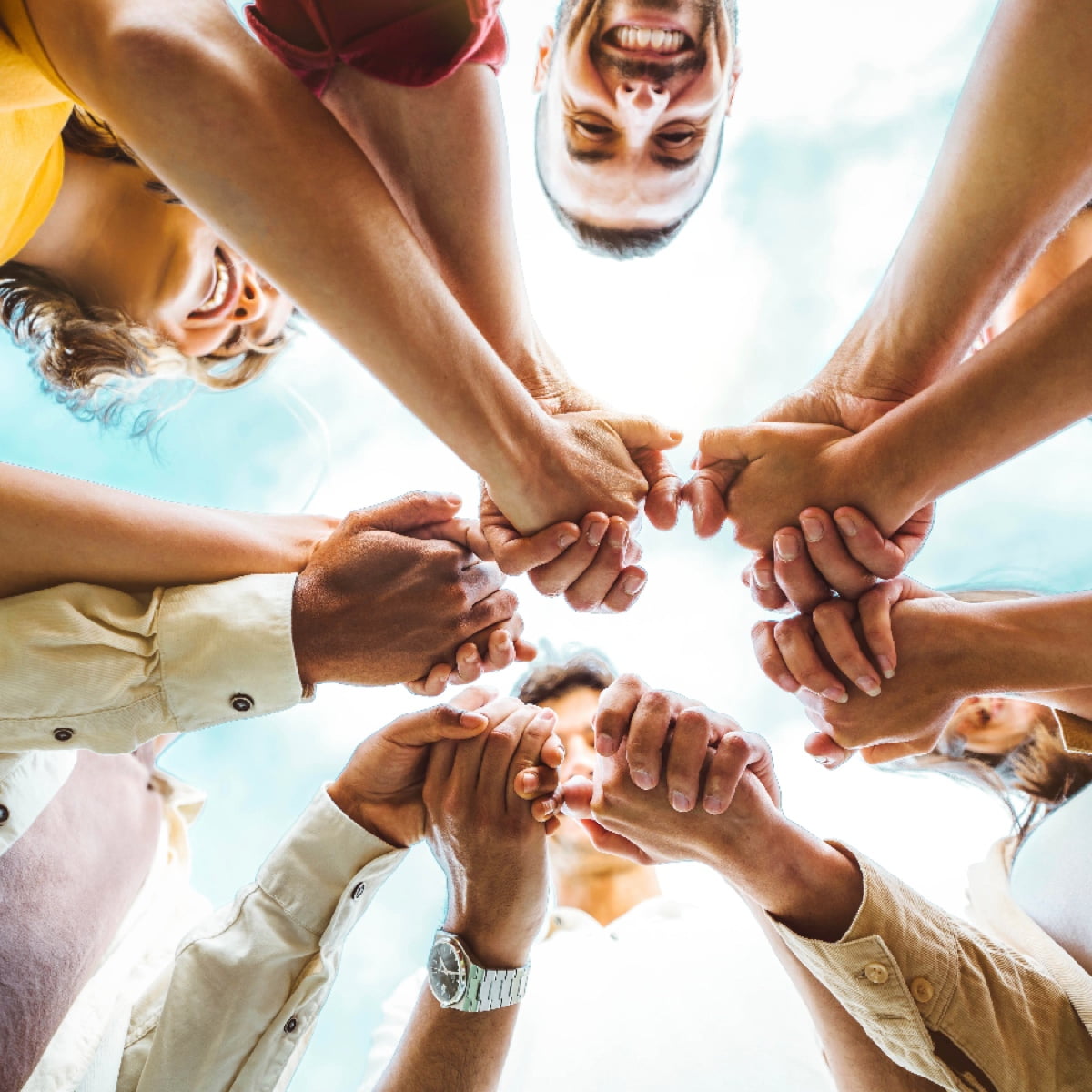 Students holding hands in a circle