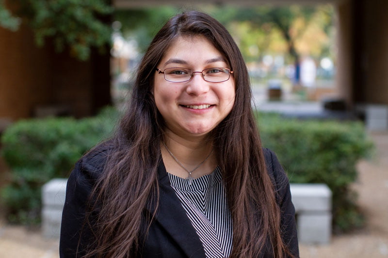 A student poses for a portrait