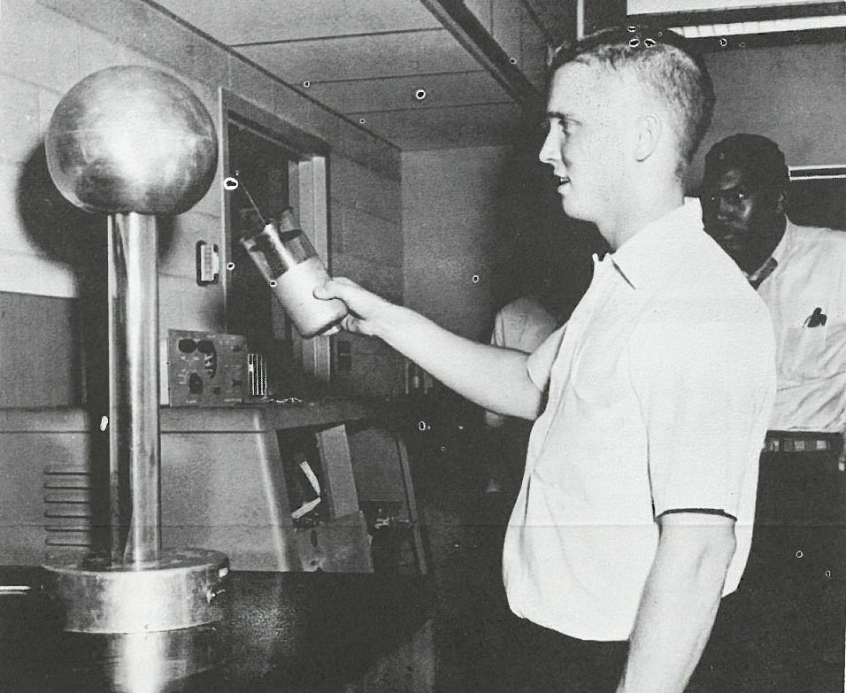 A student conducts an experiment in a physics lab in 1966.