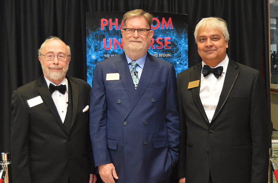 Photo showing Michael Barnett, George Smoot, and Kaushik De at the 'Phantom of the Universe' premiere gala at the UTA Planetarium.