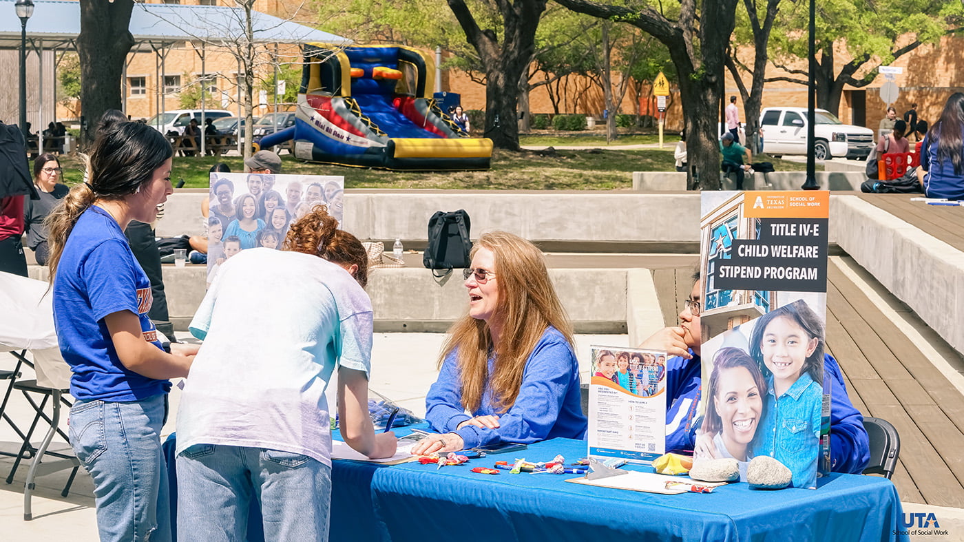 The Title IV-E booth setup during the School of Social Work Block Party event