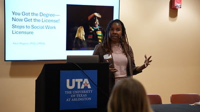 Assistant Professor of Practice, Kelli Rogers, speaking during the 2025 UTA Social Work Symposium.