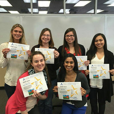 Students holding their certificates