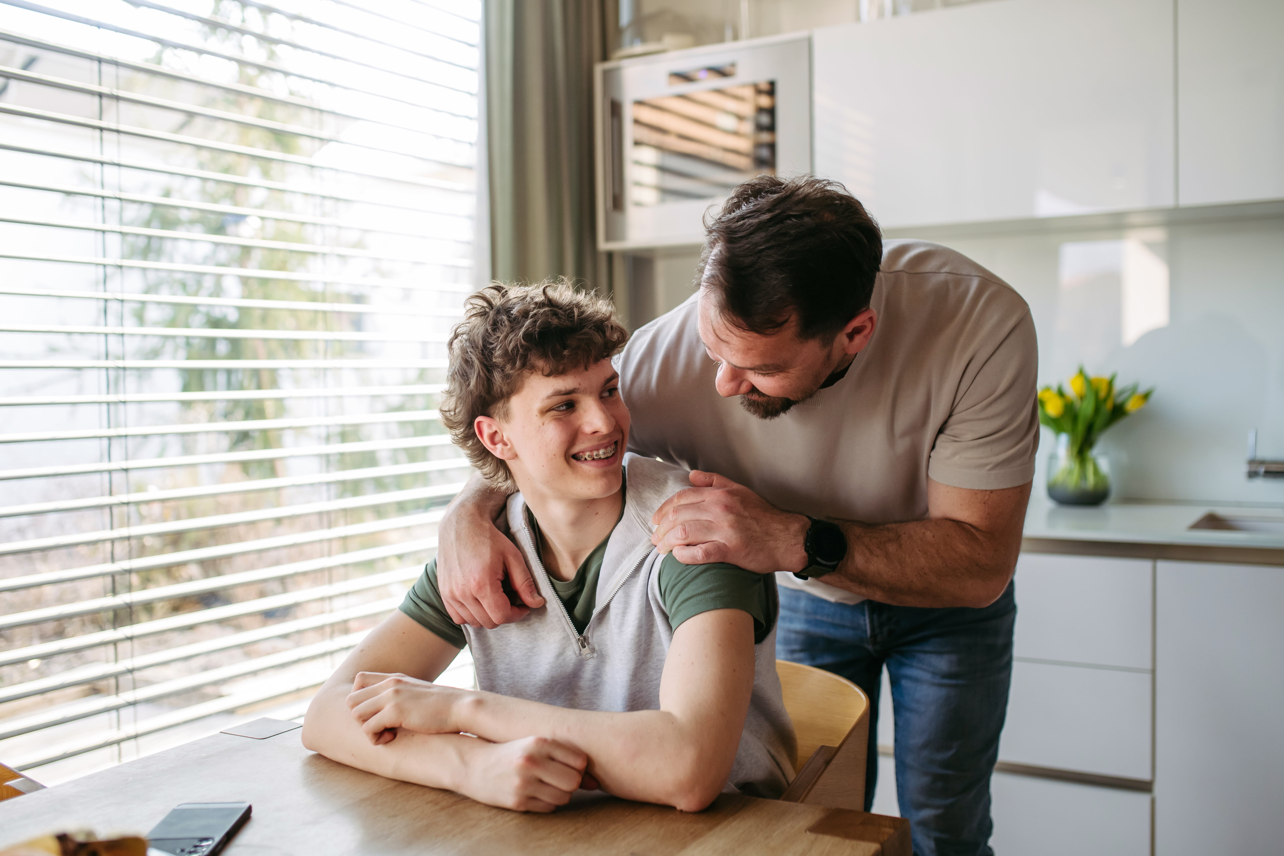Father having conversation with son.