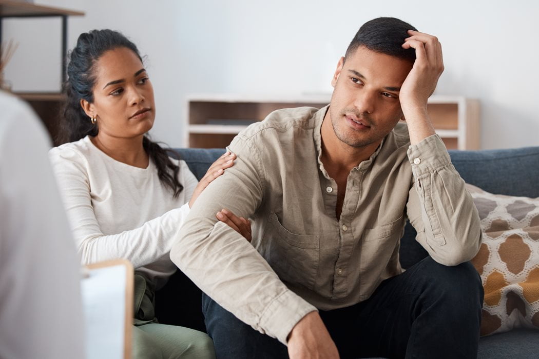 Couple on couch going through a counseling session