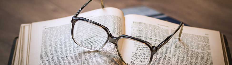 Eye glasses on book