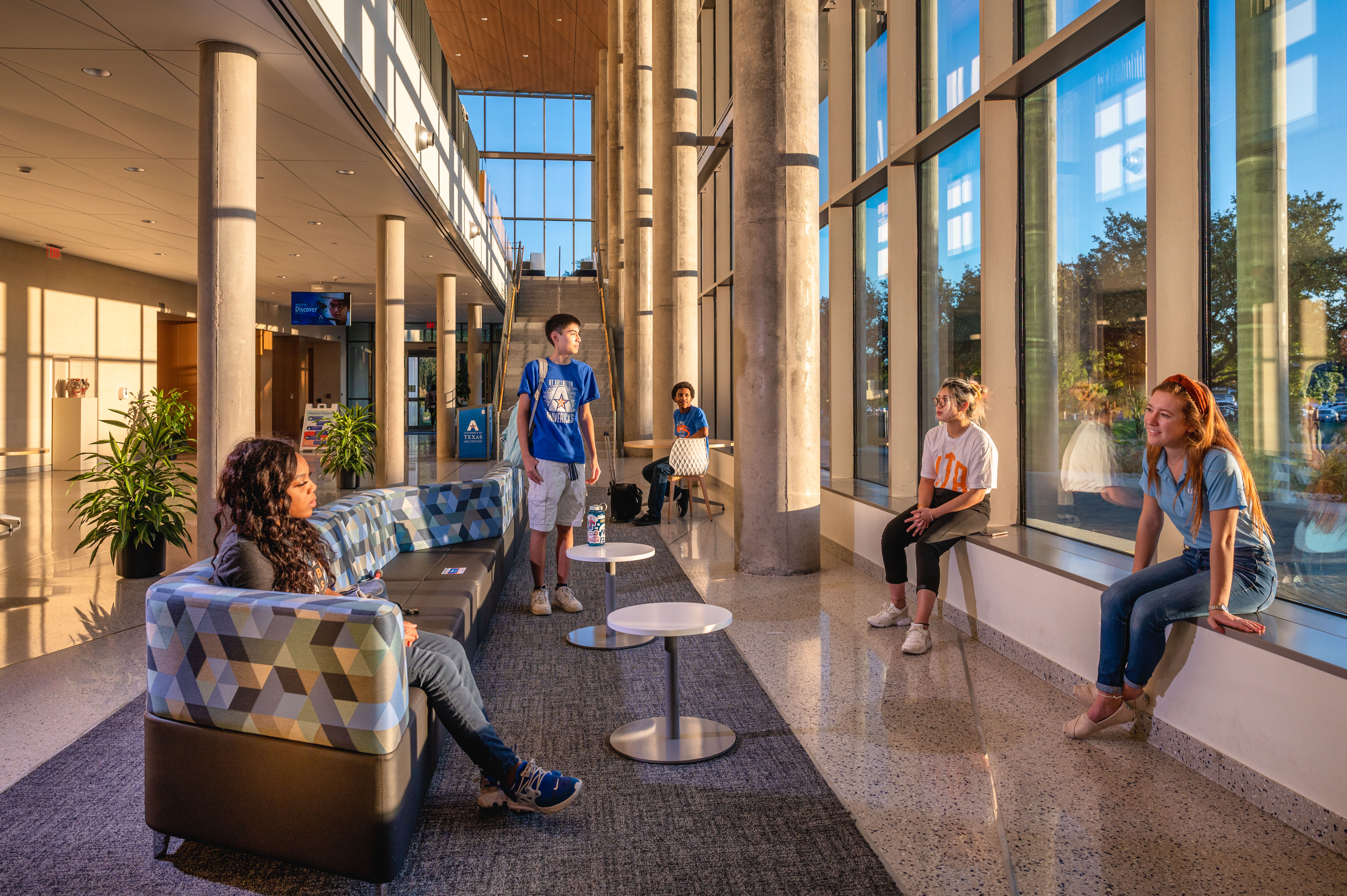 UTA students sitting in the lobby