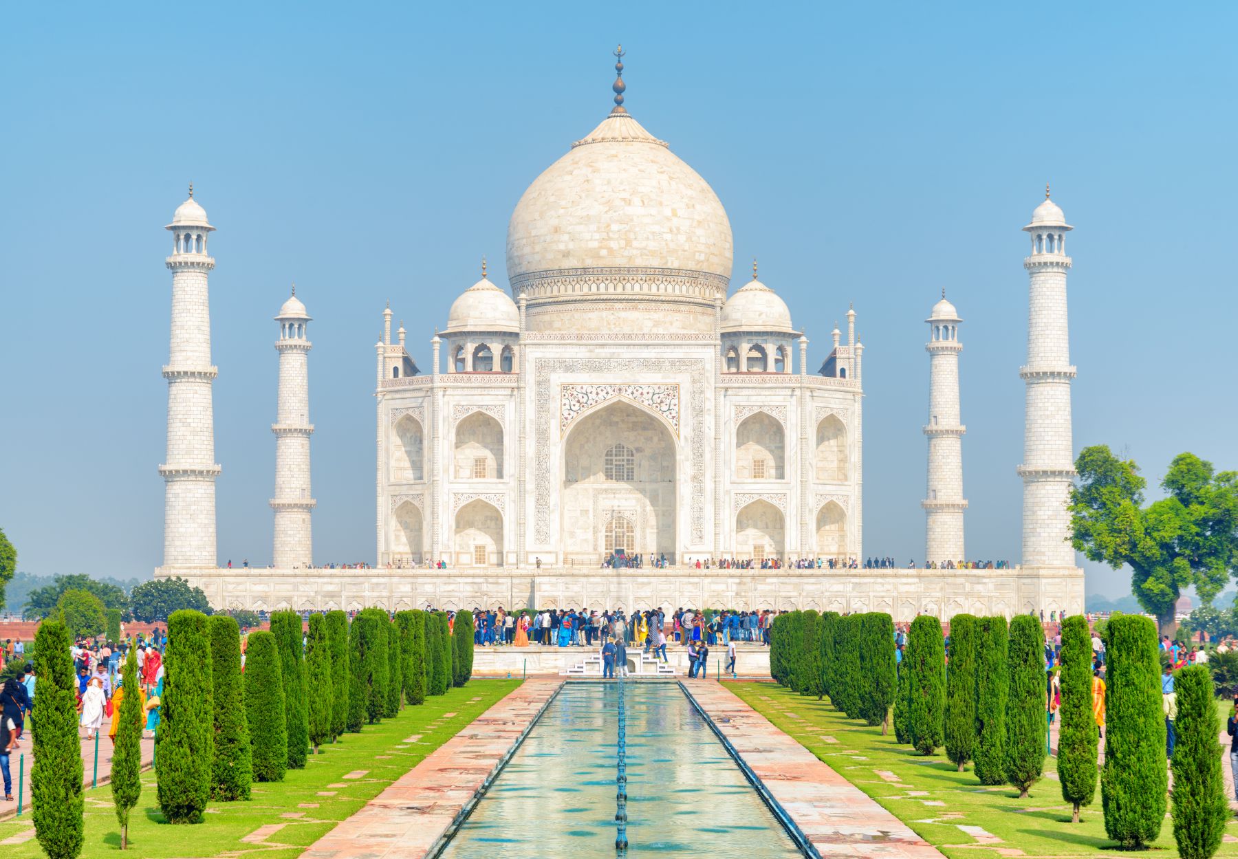 Crowd of tourists walking along the Taj Mahal complex