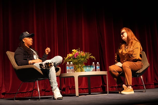 Punkie Johnson (left) and Dr. De'An Roper (right) speaking on stage at Texas Hall