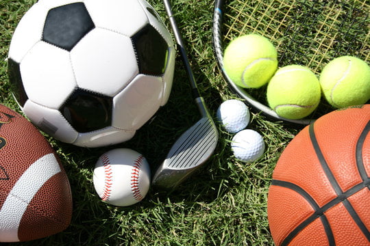 A photo of a football, soccer ball, basketball, and tennis balls