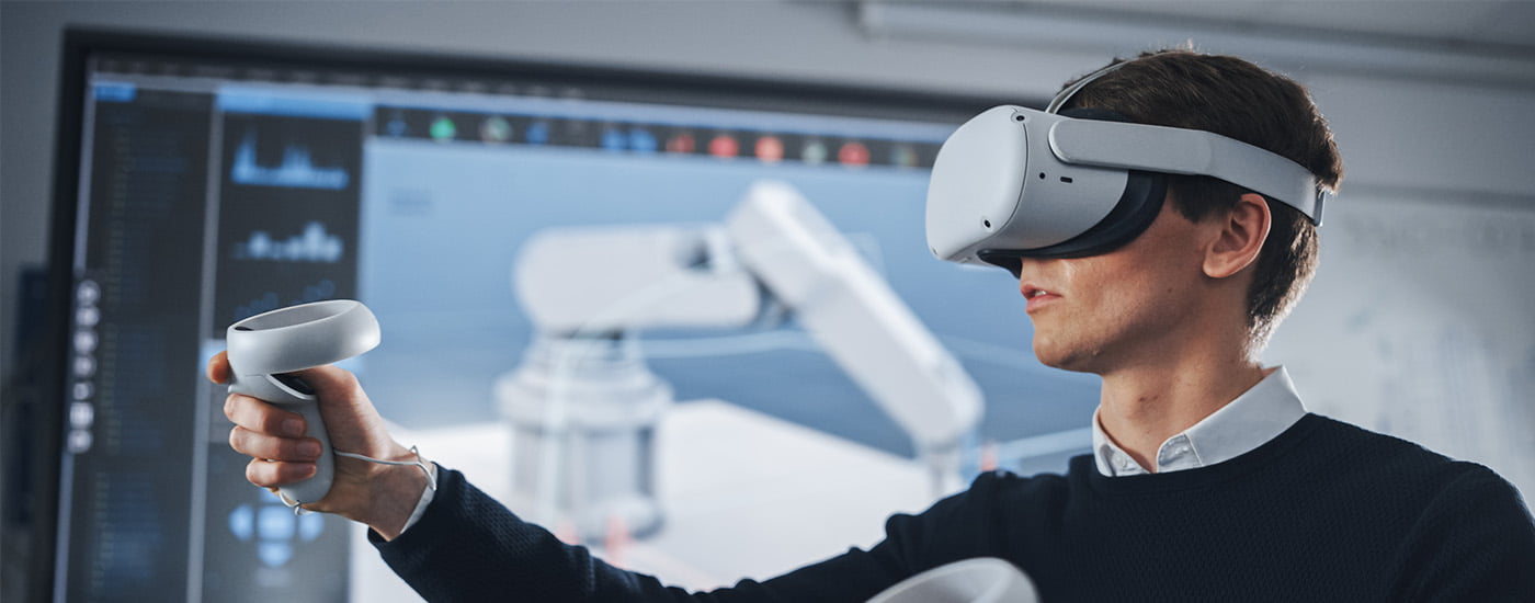 A person wearing VR glasses and using hand controllers