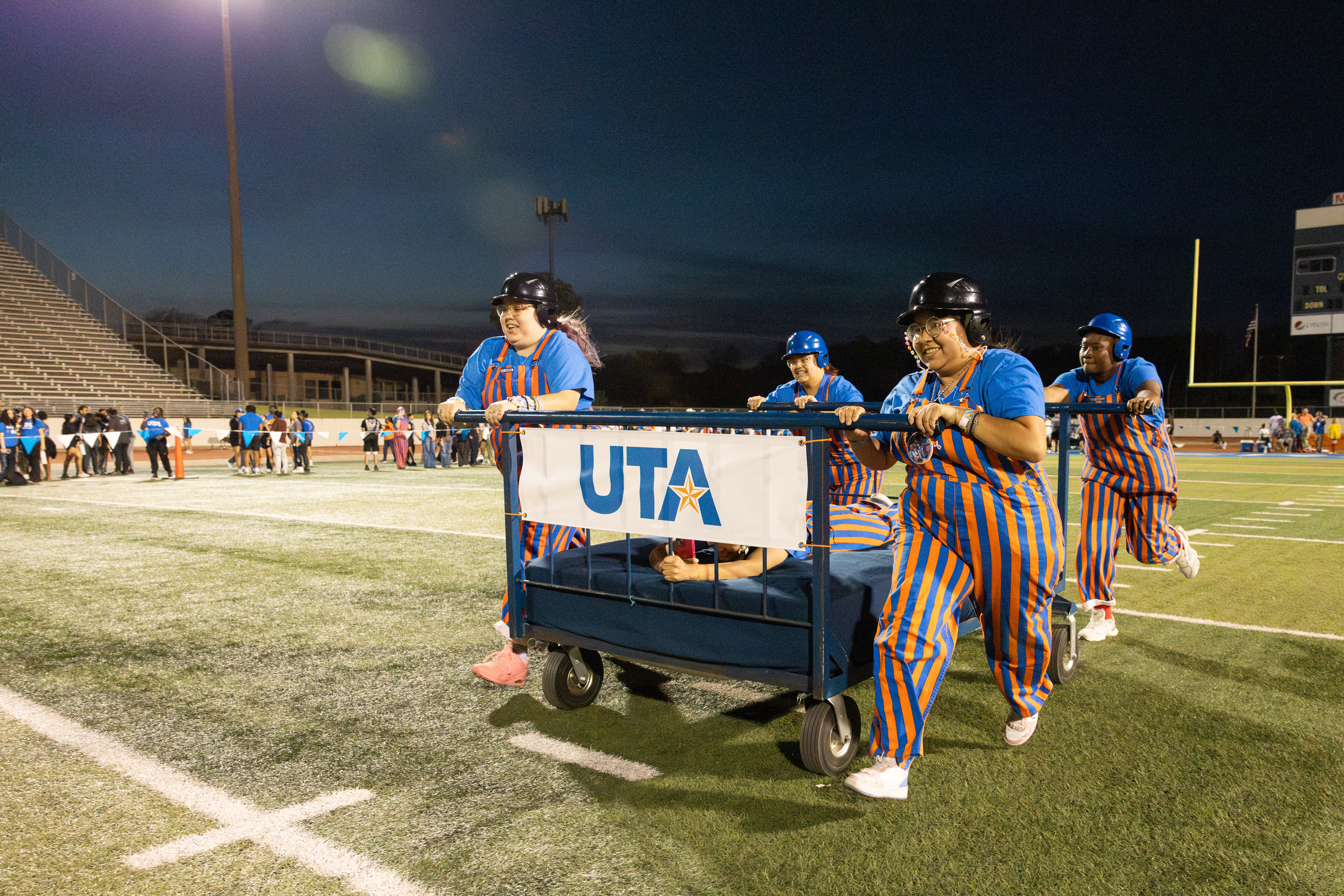 Photo of students participating in annual bed races event