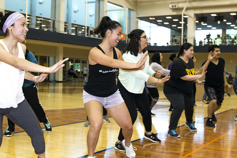 Participants of Zumbathon laughing as they don't usually dance