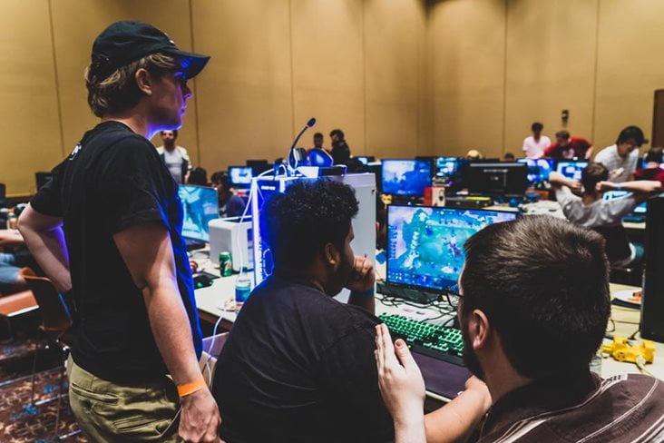 group of students in front of computers at the esports event