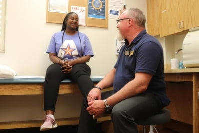 Patient with a doctor at a clinic