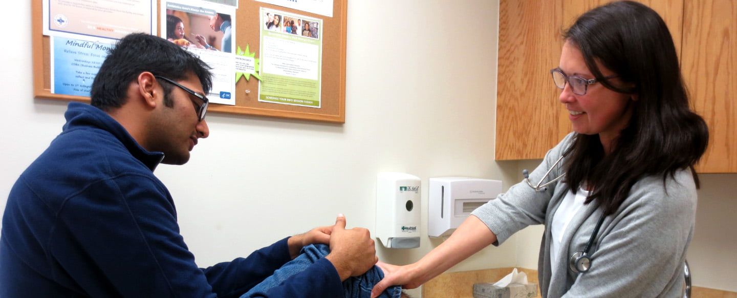 A student getting a knee check up