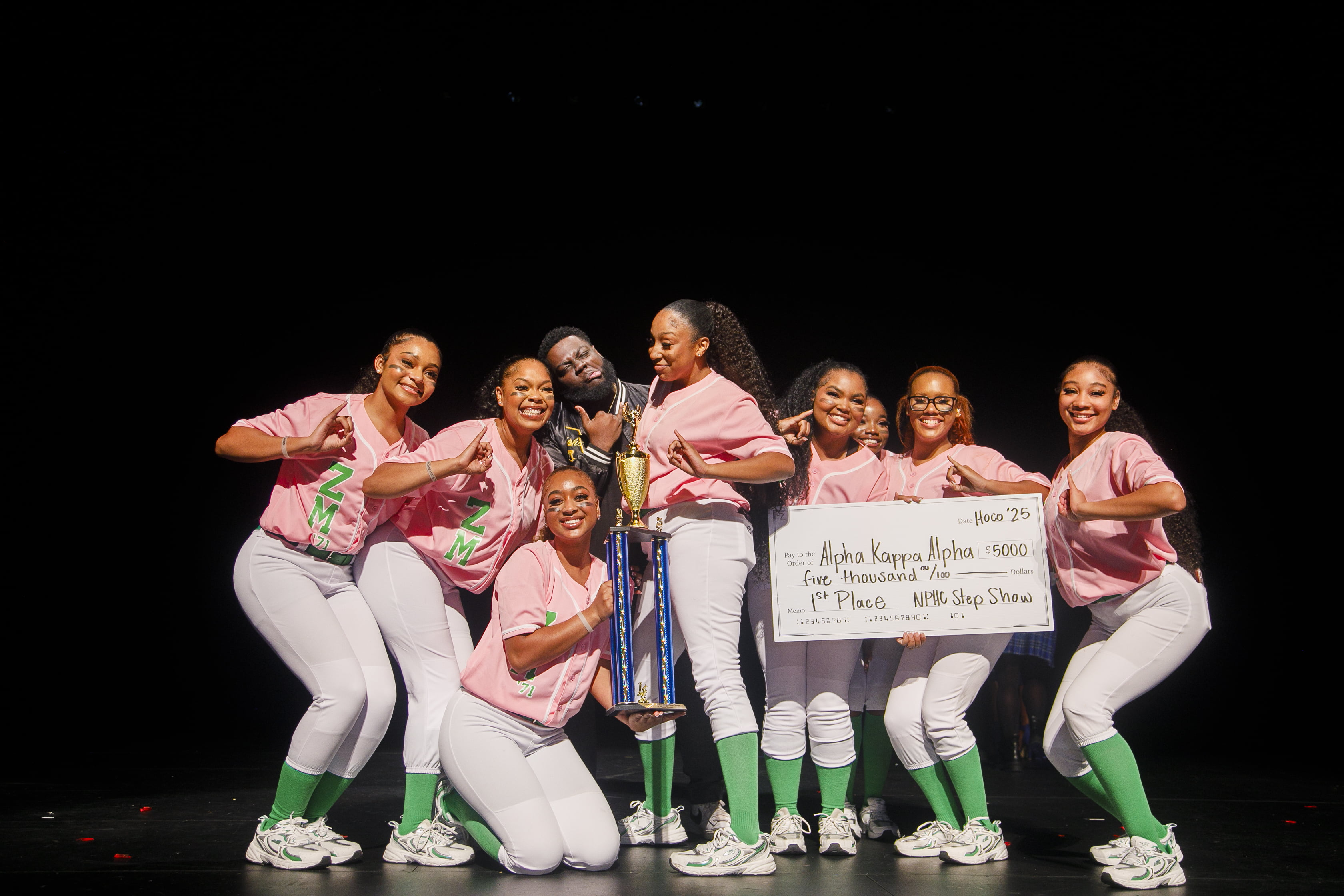 NPHC Step show winners holding up a check