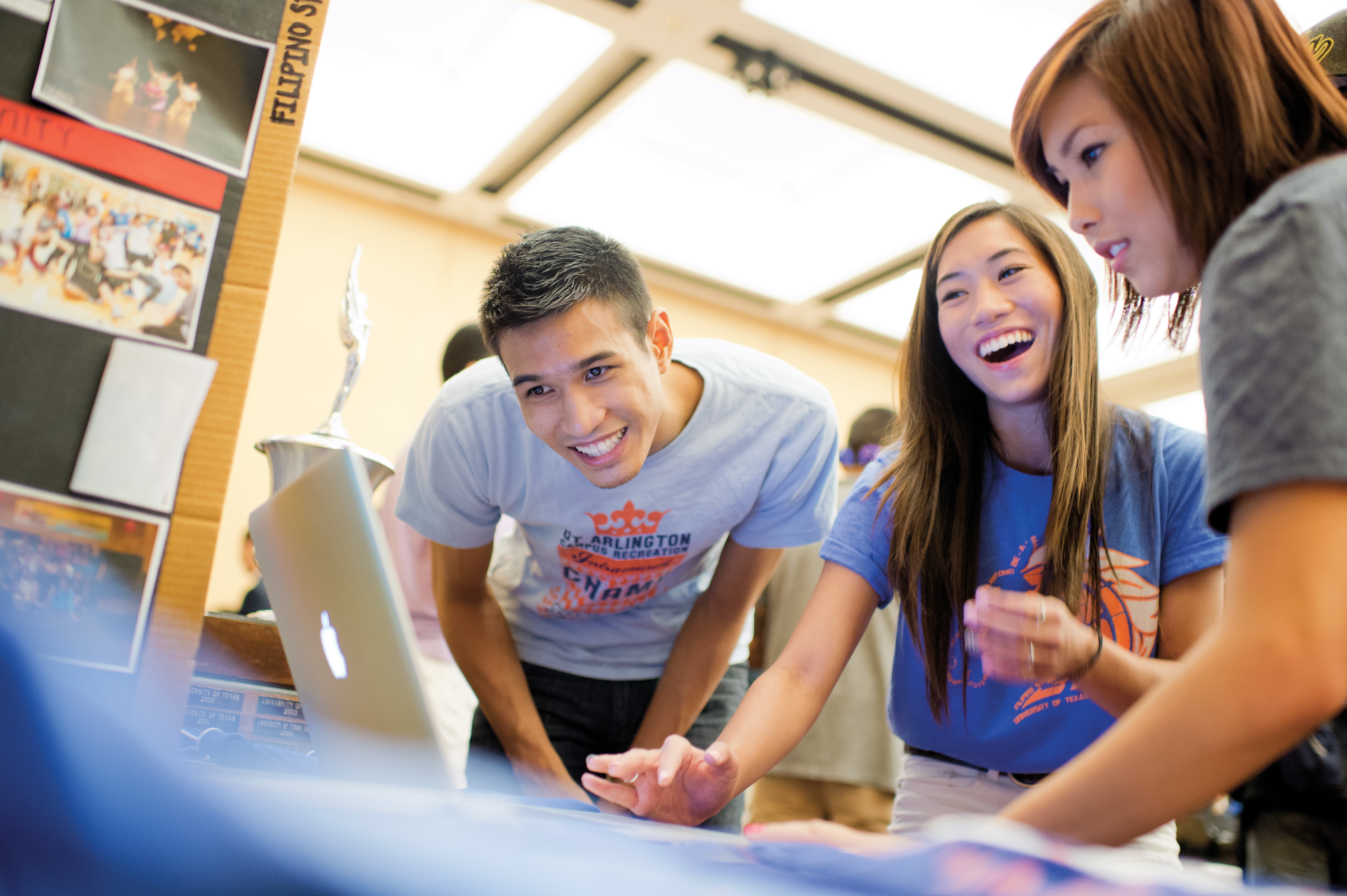 Students working on a computer together.