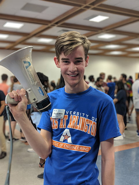 Student with a mega phone at Freshmen leaders on campus event