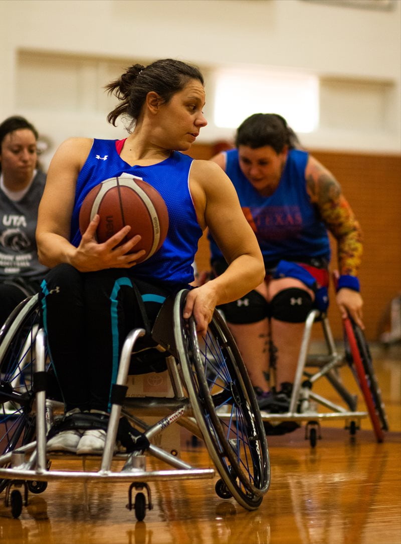 Lady Movin' Mav protecting the ball from an pursuing opponent