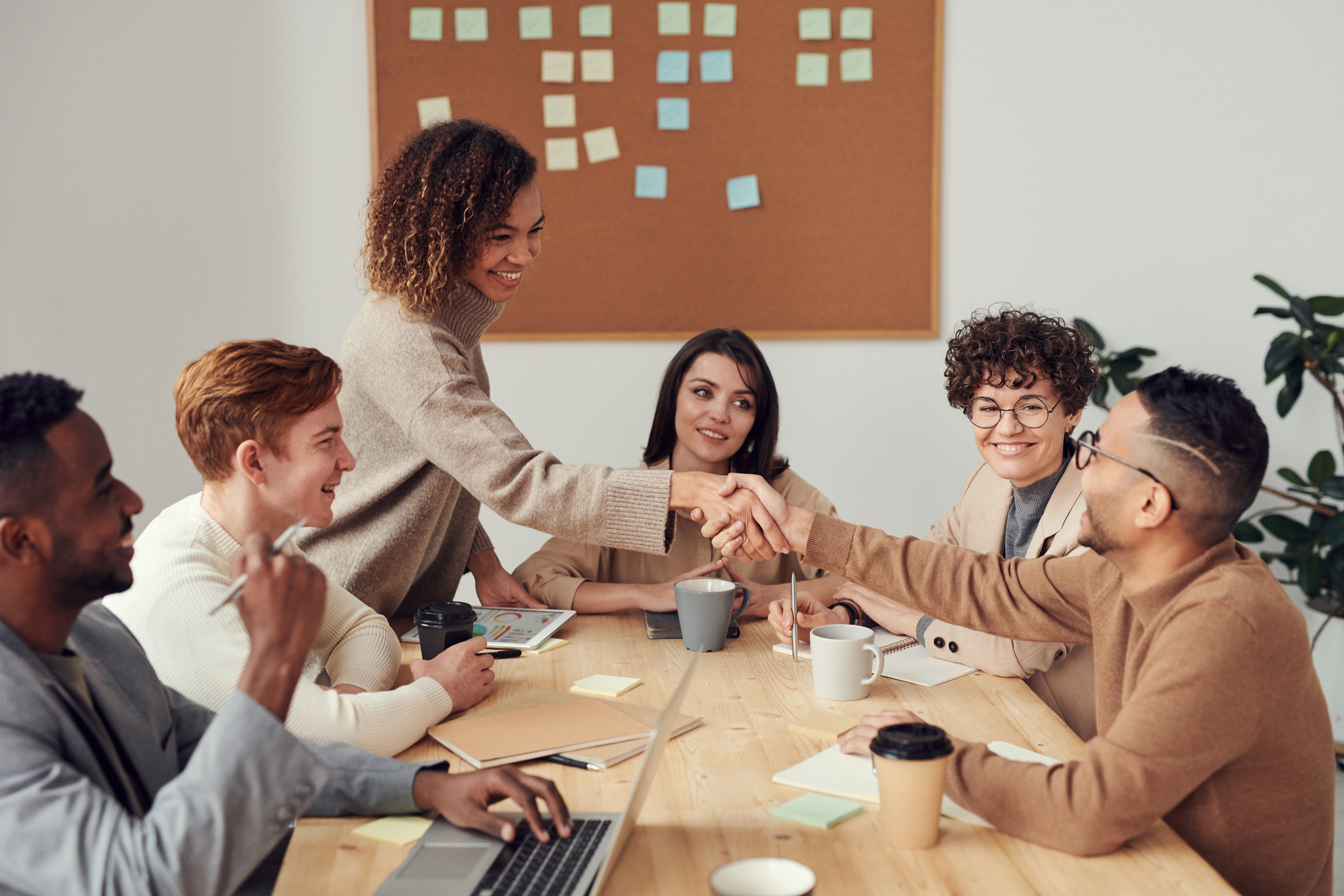 A group of smiling people in a meeting