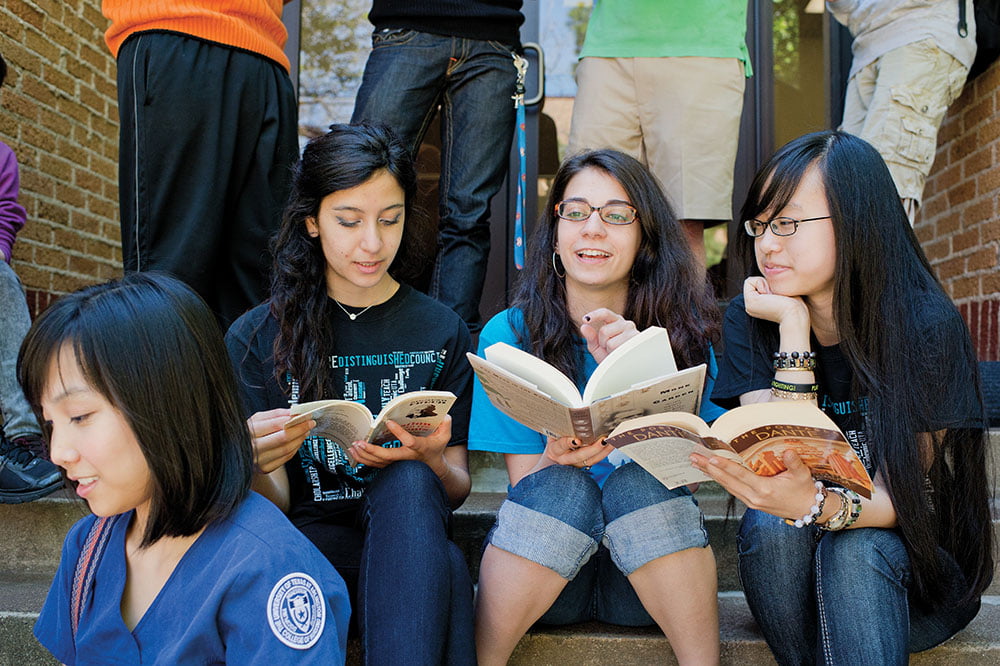 students reading books together