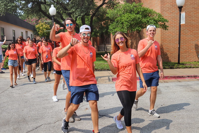 Group of students walking to the Mavmeets Convocation after party.