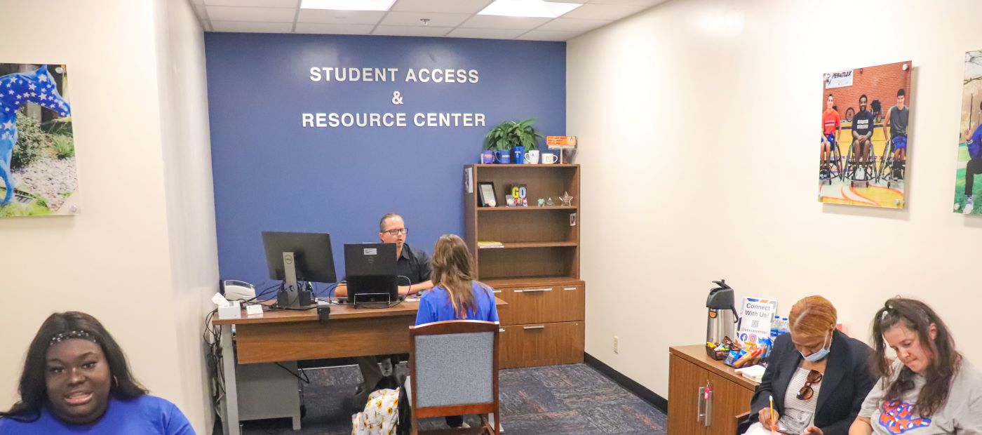 Image of students sitting in SAR Center lobby
